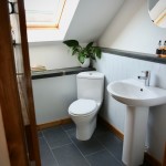 Bright main bathroom with wc, sink, bath and over bath shower